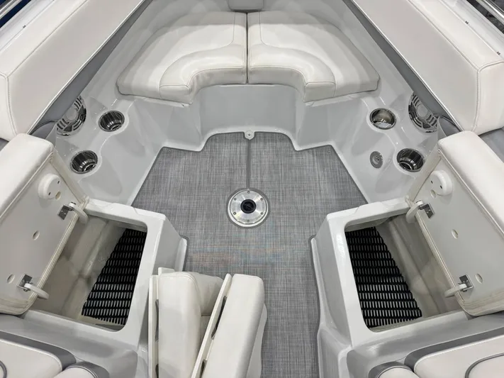  Yacht Photos Pics 2013 Formula 290 Bowrider interior with white seating and cup holders.