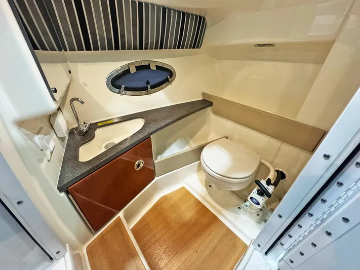  Yacht Photos Pics Luxurious bathroom in 2013 Formula 290 Bowrider boat with sink and toilet.