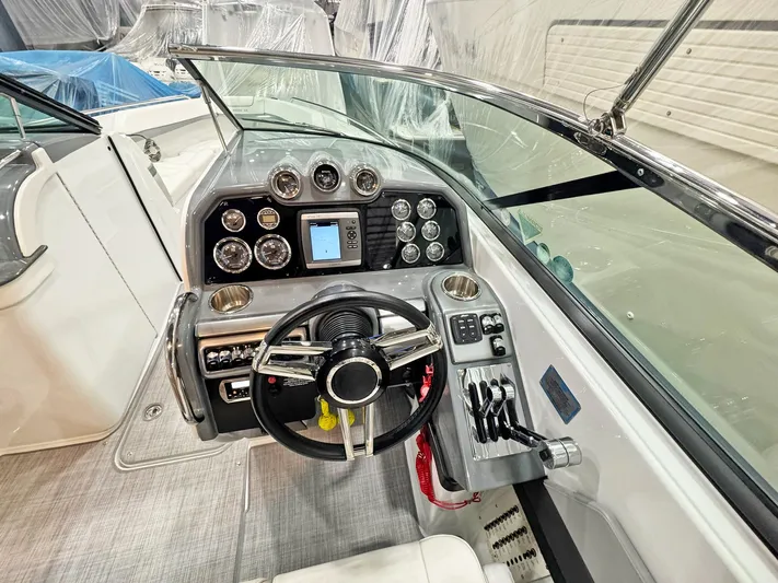  Yacht Photos Pics 2013 Formula 290 Bowrider dashboard with steering wheel and control panel.