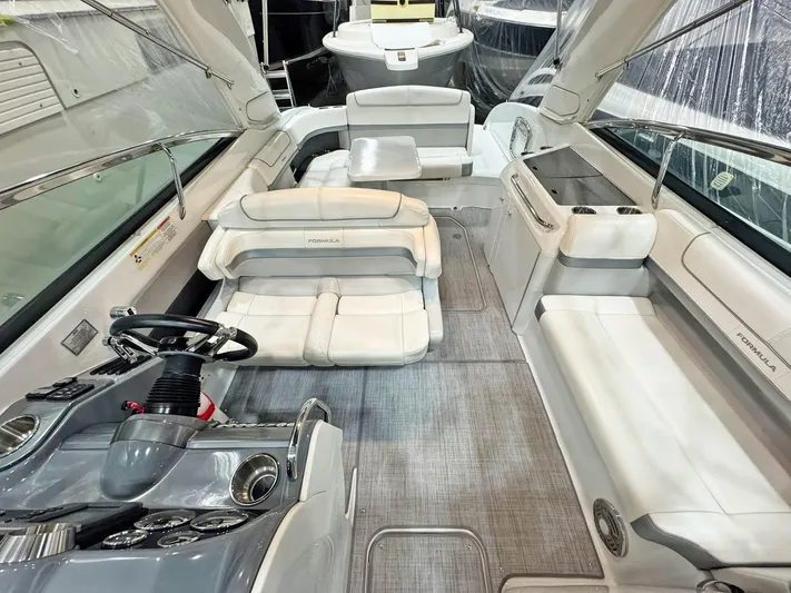  Yacht Photos Pics 2013 Formula 290 Bowrider interior with luxurious seating and modern dashboard.