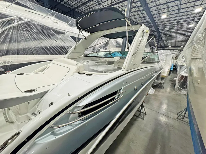  Yacht Photos Pics 2013 Formula 290 Bowrider in storage, showcasing sleek design and spacious seating.
