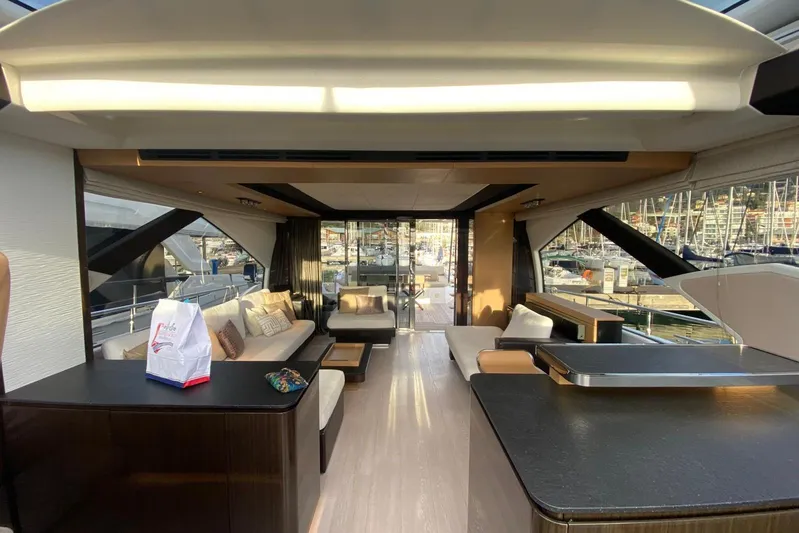  Yacht Photos Pics Luxurious interior of 2016 Azimut 77S yacht with modern furnishings and marina view.