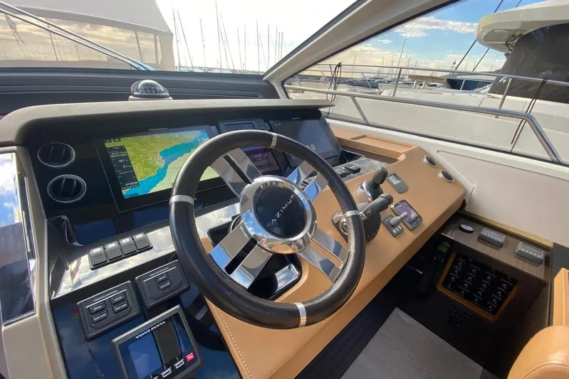  Yacht Photos Pics Cockpit of 2016 Azimut 77S yacht with modern navigation controls and steering wheel.