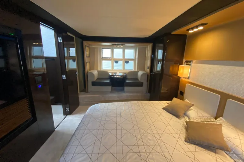  Yacht Photos Pics Luxurious interior of 2016 Azimut 77S yacht with elegant bedroom and seating area.