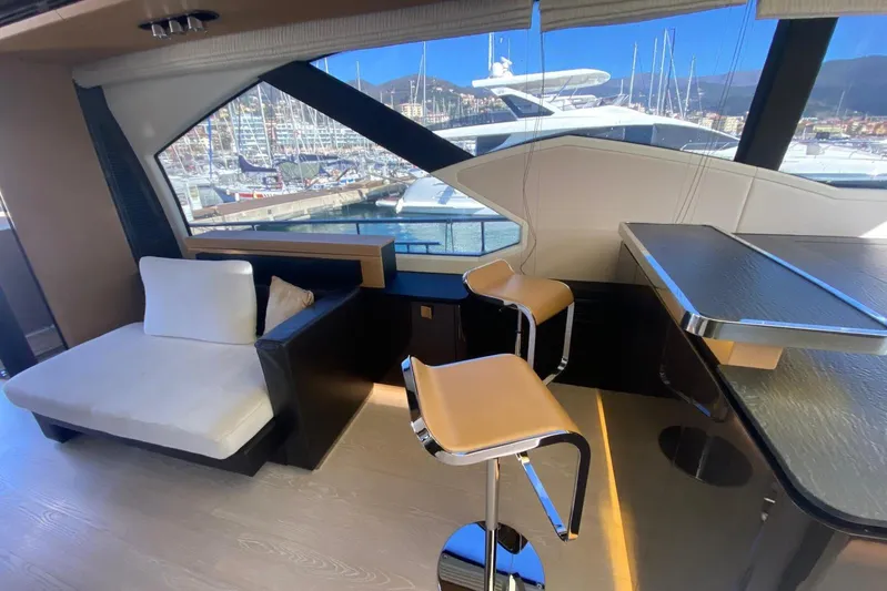  Yacht Photos Pics Luxurious interior of 2016 Azimut 77S yacht with modern seating and marina view.