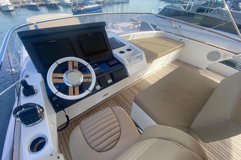  Yacht Photos Pics Flybridge of 2016 Azimut 77S yacht with modern helm and seating area.