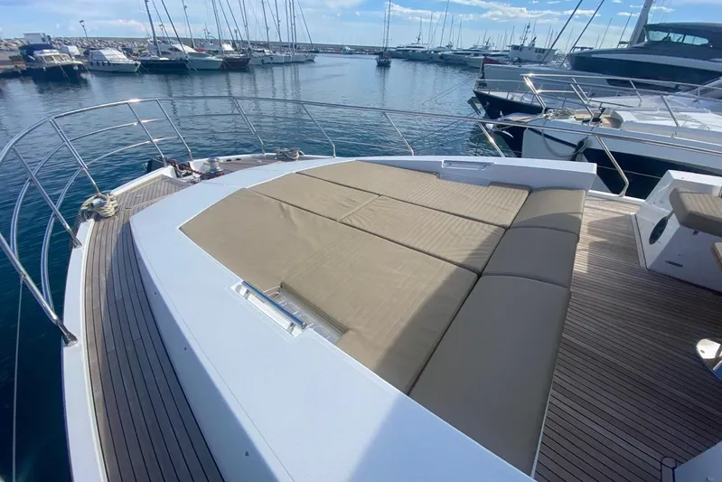  Yacht Photos Pics Luxurious 2016 Azimut 77S yacht with spacious sunbathing deck in marina setting.