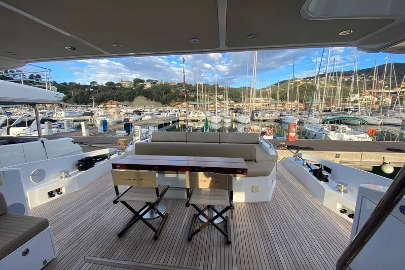  Yacht Photos Pics Luxurious 2016 Azimut 77S yacht docked in a scenic marina with elegant seating.