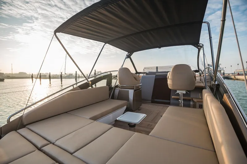  Yacht Photos Pics Luxurious 2016 Wider 32 yacht interior with sun deck and seating, docked at sunrise.