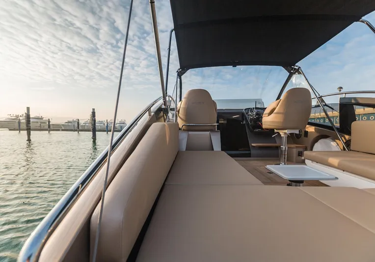 Yacht Photos Pics Luxurious 2016 Wider 32 yacht interior with beige seating and scenic marina view.