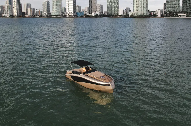  Yacht Photos Pics Luxury Wider 32 yacht cruising near city skyline, 2016 model.