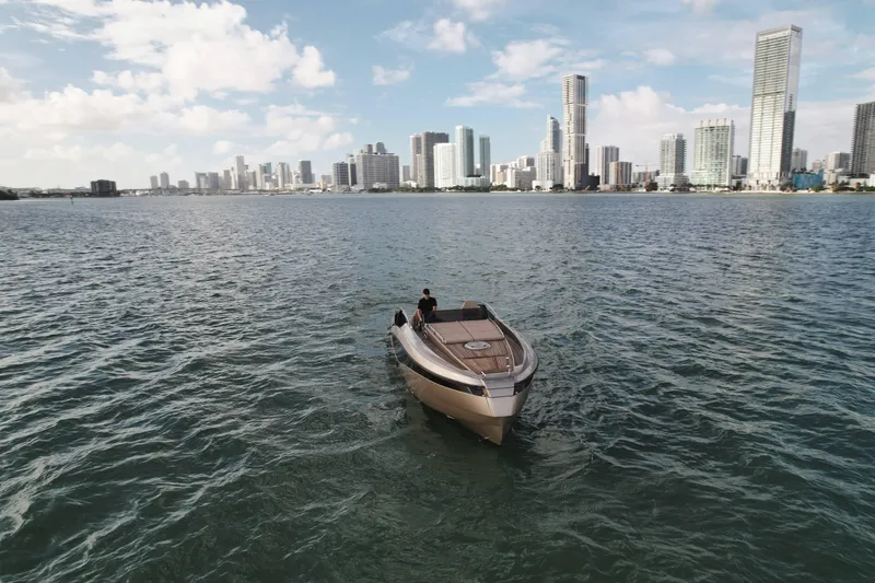  Yacht Photos Pics Luxury Wider 32 boat cruising near city skyline, 2016 model.