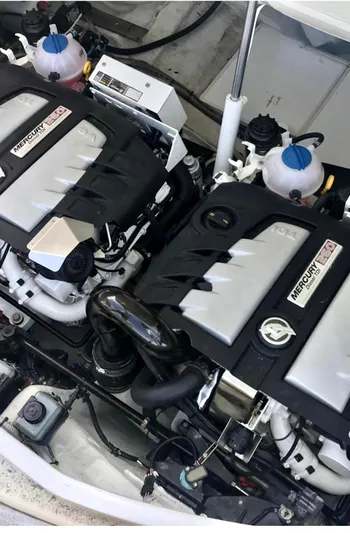  Yacht Photos Pics Twin Mercury engines in a 2016 Wider 32 boat, showcasing advanced marine engineering.