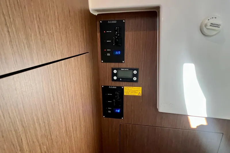  Yacht Photos Pics Control panel inside 2024 Beneteau Antares 11 boat, featuring digital displays and switches.