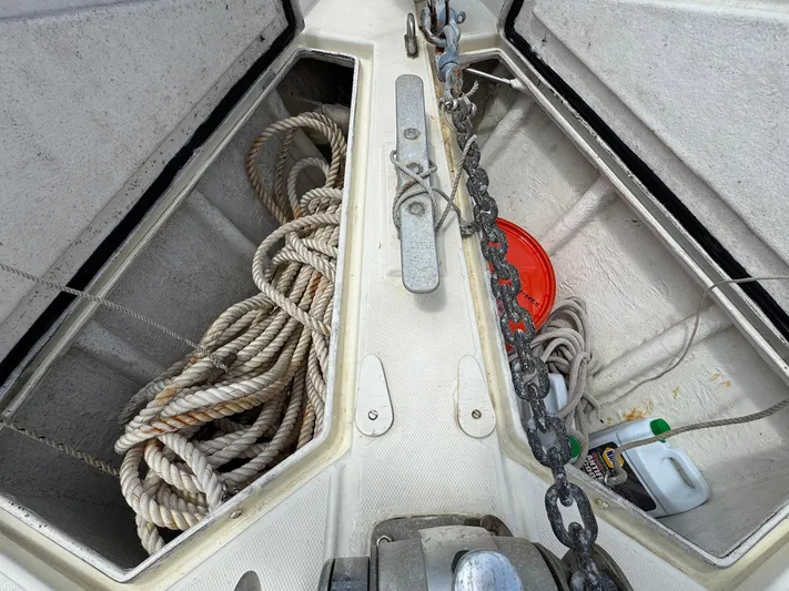Northern Goose Yacht Photos Pics Anchor locker of 1980 Amel Mango 52 sailboat with ropes and chain.