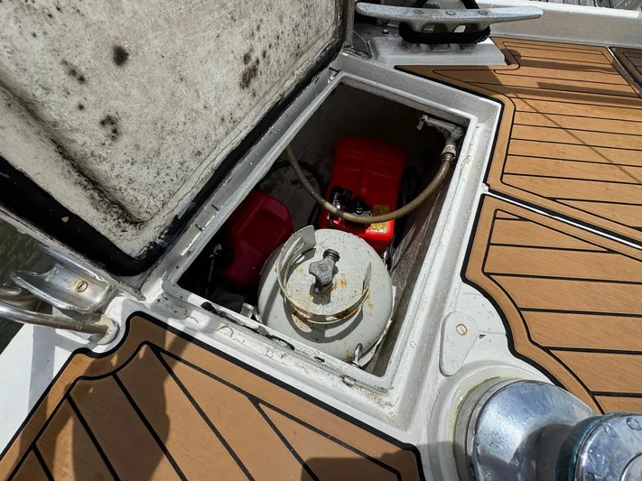 Northern Goose Yacht Photos Pics Open hatch on 1980 Amel Mango 52 sailboat deck, revealing storage compartment.