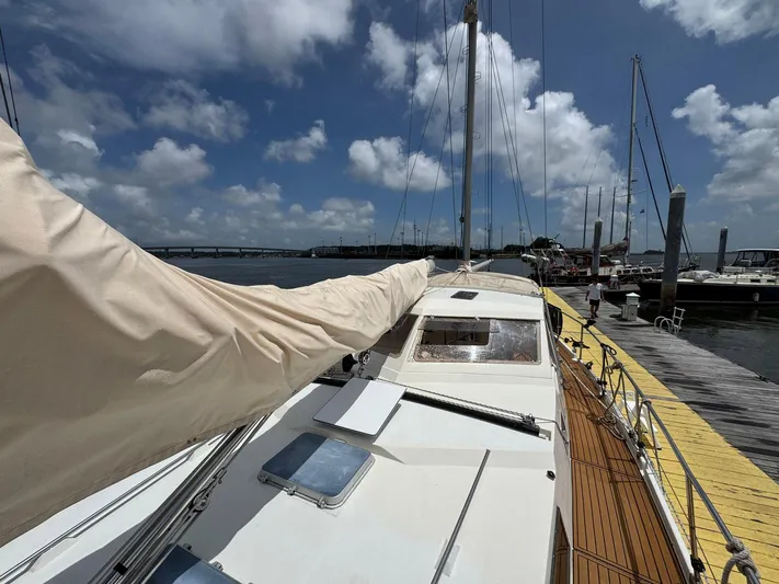 Northern Goose Yacht Photos Pics 1980 Amel Mango 52 yacht docked at marina under blue sky.