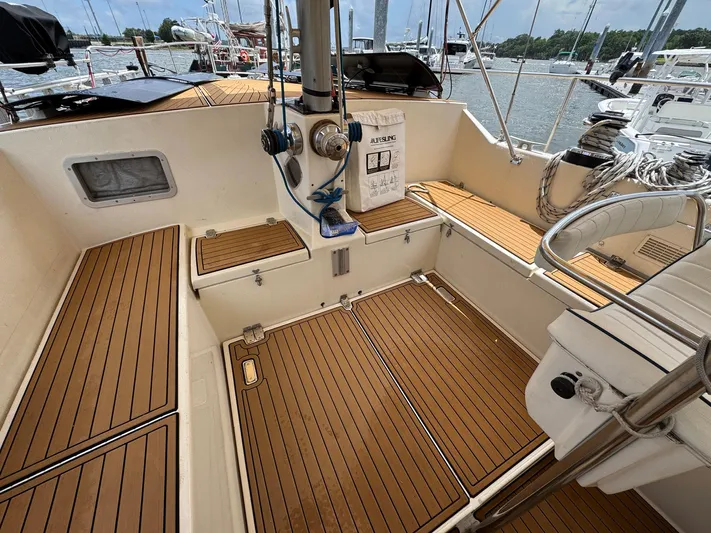Northern Goose Yacht Photos Pics Cockpit of 1980 Amel Mango 52 sailboat with teak flooring and nautical equipment.