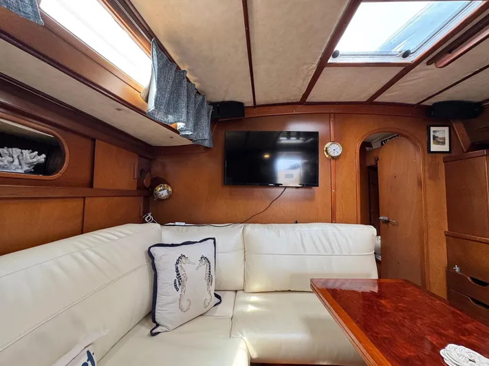 Northern Goose Yacht Photos Pics Interior of 1980 Amel Mango 52 yacht with cozy seating and modern amenities.