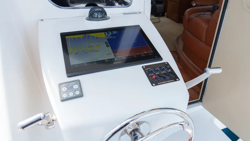 Benedetta Yacht Photos Pics Control panel of 2012 Viking 70 Enclosed Bridge yacht with navigation display.