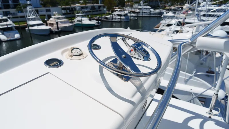 Benedetta Yacht Photos Pics Steering wheel of 2012 Viking 70 Enclosed Bridge yacht at marina.