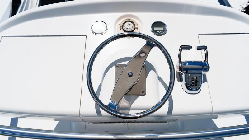 Benedetta Yacht Photos Pics Steering wheel and controls of 2012 Viking 70 Enclosed Bridge yacht.