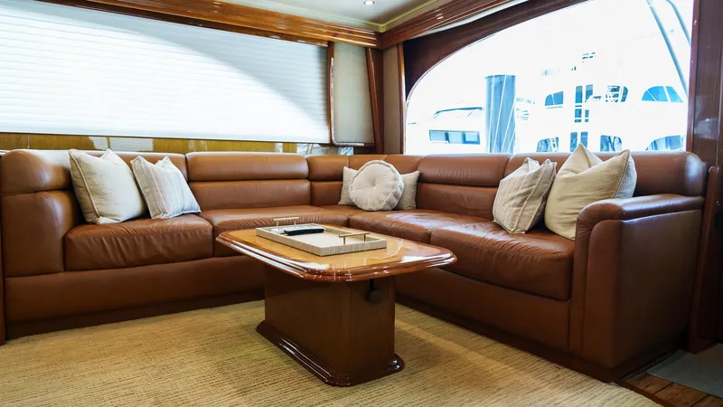 Benedetta Yacht Photos Pics Luxurious interior of 2012 Viking 70 Enclosed Bridge yacht with leather seating and elegant decor.