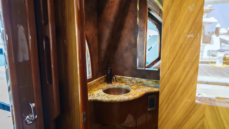 Benedetta Yacht Photos Pics Luxurious bathroom interior on 2012 Viking 70 Enclosed Bridge yacht with granite countertop.