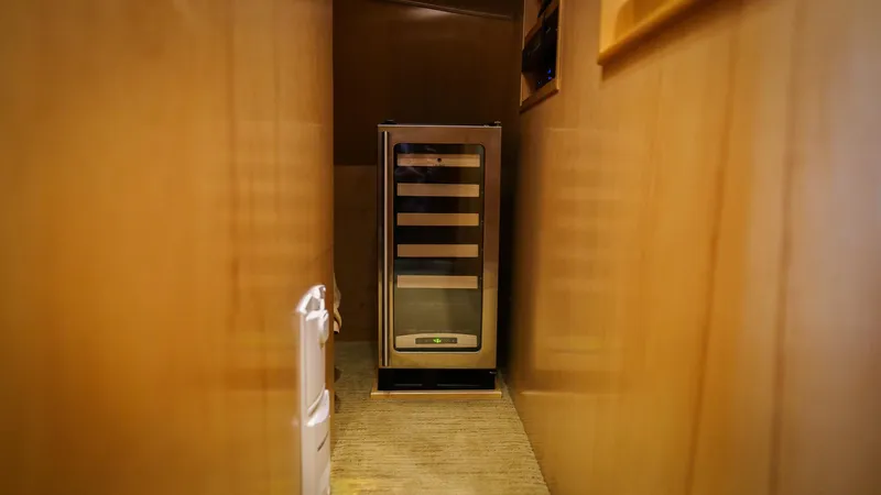 Benedetta Yacht Photos Pics Compact wine cooler in hallway of 2012 Viking 70 Enclosed Bridge yacht.