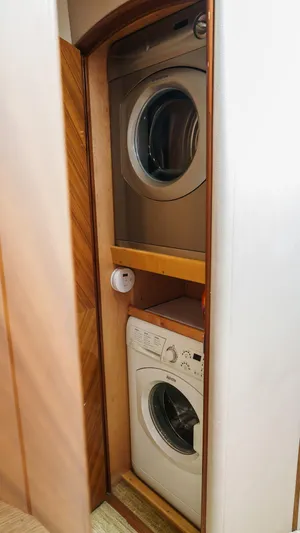 Benedetta Yacht Photos Pics Stacked washer and dryer in 2012 Viking 70 Enclosed Bridge yacht.