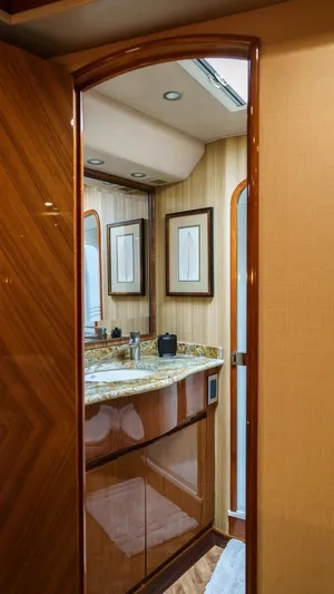 Benedetta Yacht Photos Pics Luxurious bathroom interior of 2012 Viking 70 Enclosed Bridge yacht with wood accents.