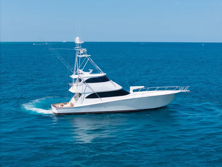 Benedetta Yacht Photos Pics 2012 Viking 70 Enclosed Bridge yacht cruising on open blue sea.