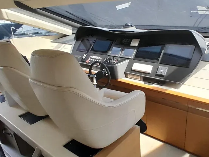 Yacht Photos Pics Luxurious 2012 Pershing 92 yacht cockpit with modern navigation controls and plush seating.