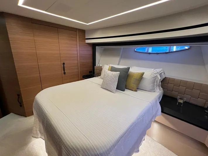  Yacht Photos Pics Luxurious bedroom interior of 2012 Pershing 92 yacht with modern design and cozy bedding.
