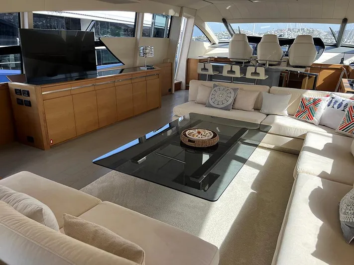  Yacht Photos Pics Luxurious interior of a 2012 Pershing 92 yacht with modern furnishings and large windows.