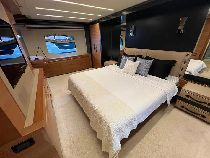  Yacht Photos Pics Luxurious bedroom interior of a 2012 Pershing 92 yacht with modern decor.