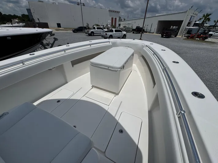  Yacht Photos Pics 2017 Invincible 33 Open Fisherman boat interior with seating and storage.