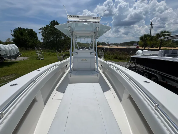  Yacht Photos Pics 2017 Invincible 33 Open Fisherman boat with Garmin equipment, parked outdoors under cloudy sky.