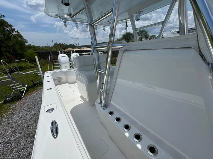  Yacht Photos Pics 2017 Invincible 33 Open Fisherman boat interior with rod holders and seating.