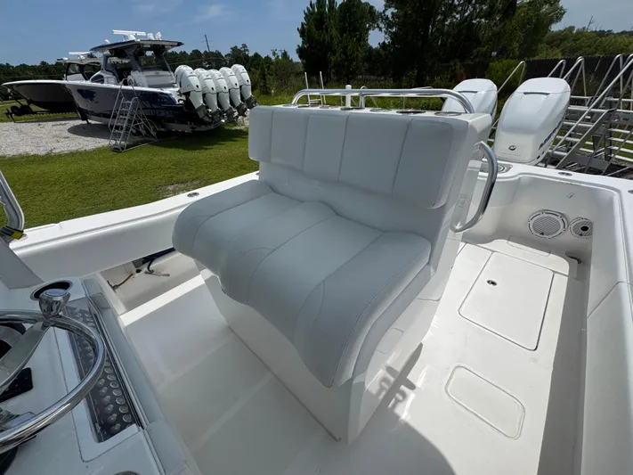  Yacht Photos Pics 2017 Invincible 33 Open Fisherman boat interior with white seating and control panel.