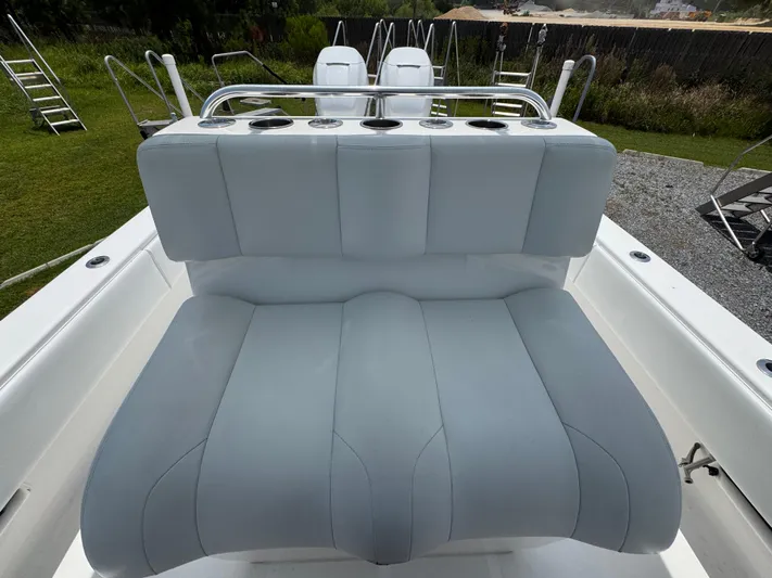  Yacht Photos Pics 2017 Invincible 33 Open Fisherman boat with cushioned seating and rod holders.