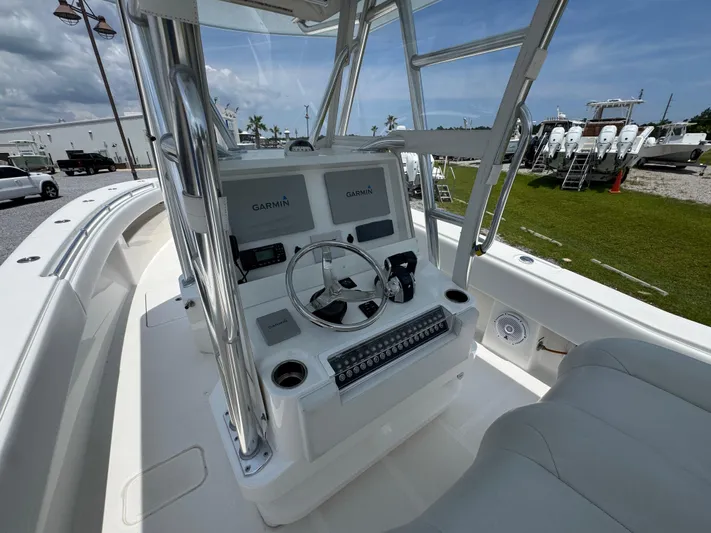 Yacht Photos Pics 2017 Invincible 33 Open Fisherman boat console with Garmin electronics and steering wheel.
