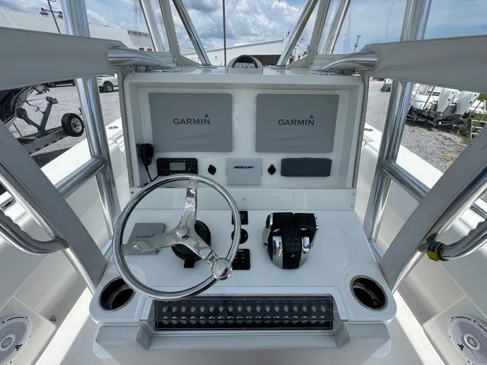  Yacht Photos Pics 2017 Invincible 33 Open Fisherman helm with Garmin displays and Mercury controls.