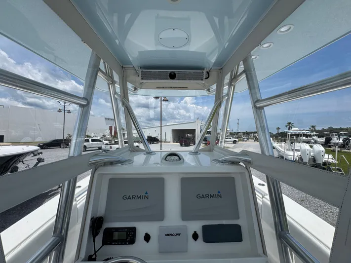  Yacht Photos Pics 2017 Invincible 33 Open Fisherman boat cockpit with Garmin navigation system.