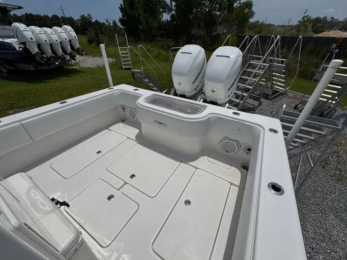  Yacht Photos Pics 2017 Invincible 33 Open Fisherman boat with dual outboard engines, spacious deck, and storage compartments.