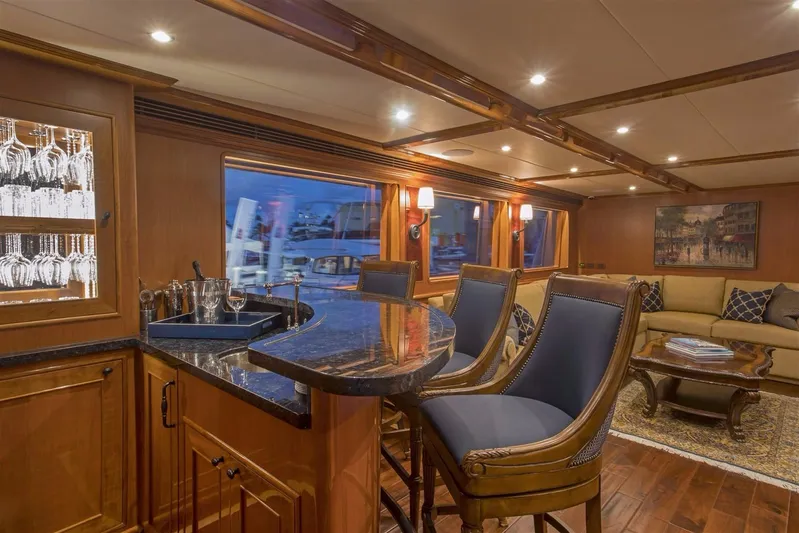 Insignia Yacht Photos Pics Luxurious interior of 2017 Outer Reef Yachts 860 Deluxbridge Motoryacht with elegant bar and seating.