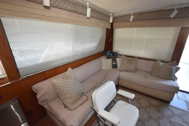Russell Hatt Yacht Photos Pics Interior of 1988 Hatteras 48 Convertible yacht with beige seating and blinds.