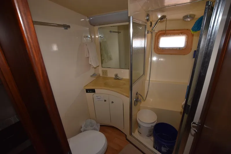 Russell Hatt Yacht Photos Pics Bathroom interior of 1988 Hatteras 48 Convertible yacht with shower and vanity.