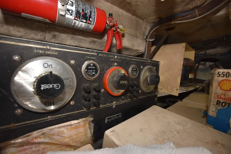 Russell Hatt Yacht Photos Pics Control panel in 1988 Hatteras 48 Convertible engine room with fire extinguisher.