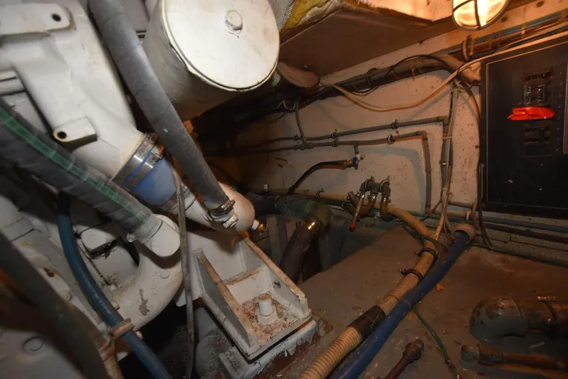 Russell Hatt Yacht Photos Pics Engine room of 1988 Hatteras 48 Convertible boat, showing mechanical components and wiring.